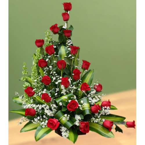 Floral arrangement roses in basket